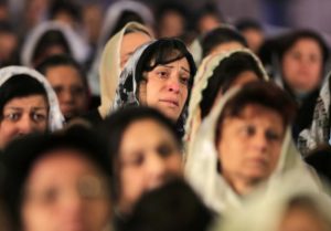 Coptic Christian women attend prayers in Cairo for Egyptians said to have been beheaded in Libya